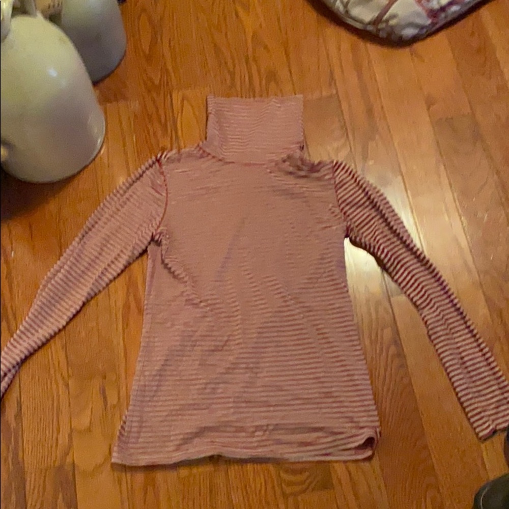 A red and black striped turtleneck shirt.